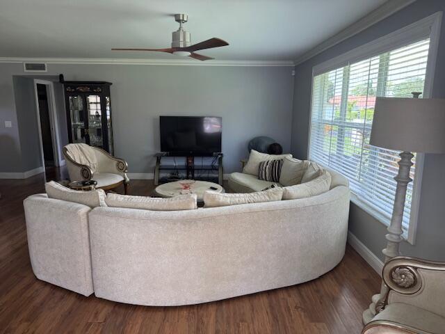 4585 Northwest 3rd Street, Unit D Delray Beach, FL 33445 - Photo 5 of 42 a living room with furniture and a flat screen tv