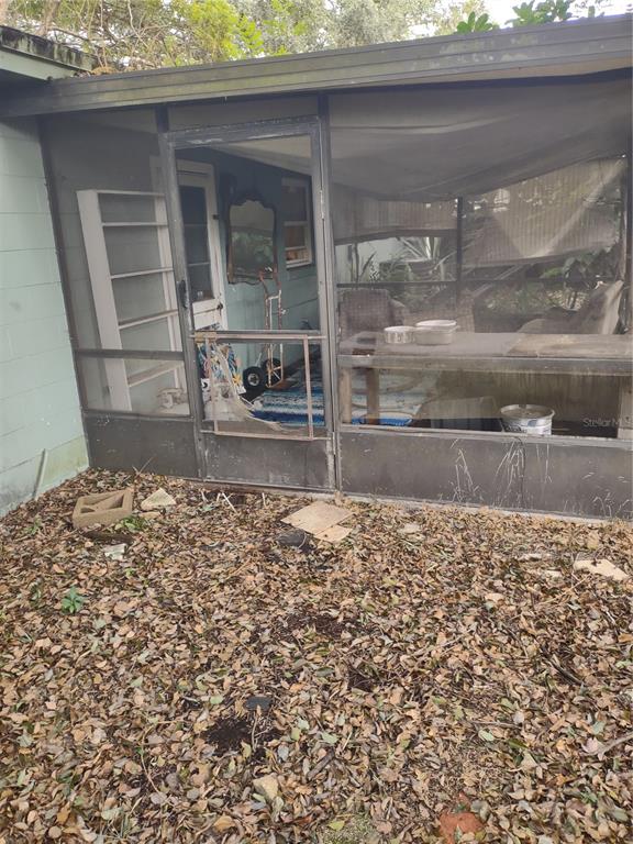 7798 Toledo Street Orlando, FL 32822 - Photo 11 of 12 a view of a entryway door of the house