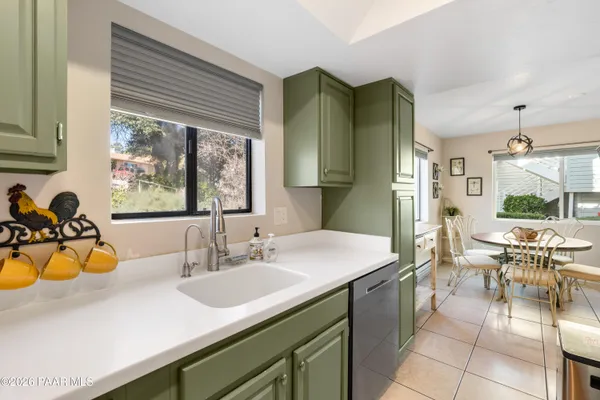 a bathroom with a sink double vanity and a mirror