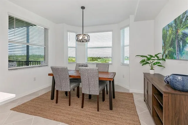 a large white kitchen with a large window