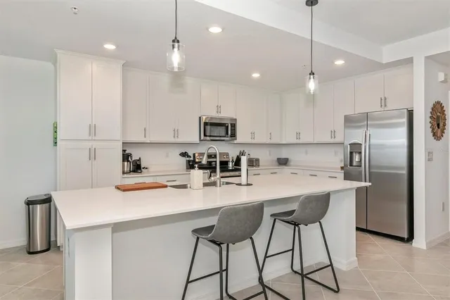 a view of a bathroom with a shower and a sink