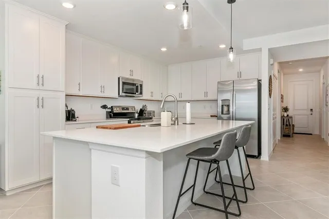 a bathroom with a toilet a sink a vanity and mirror
