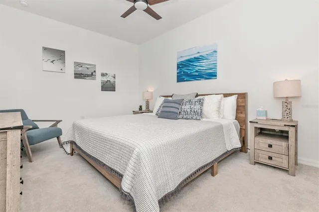 a aerial view of a house with a swimming pool and outdoor seating