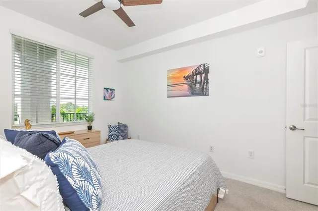 a view of a room with gym equipment and a large window