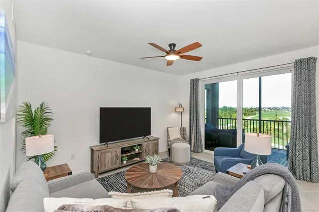 a living room with furniture and a large window
