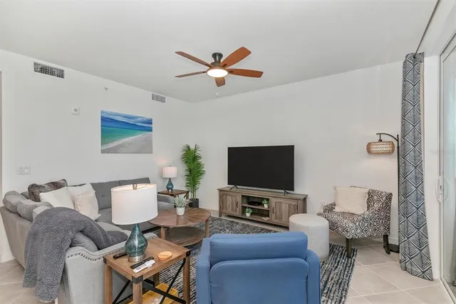 a balcony with furniture and a potted plant