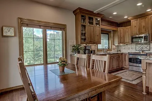 a kitchen with kitchen island granite countertop a stove and a refrigerator