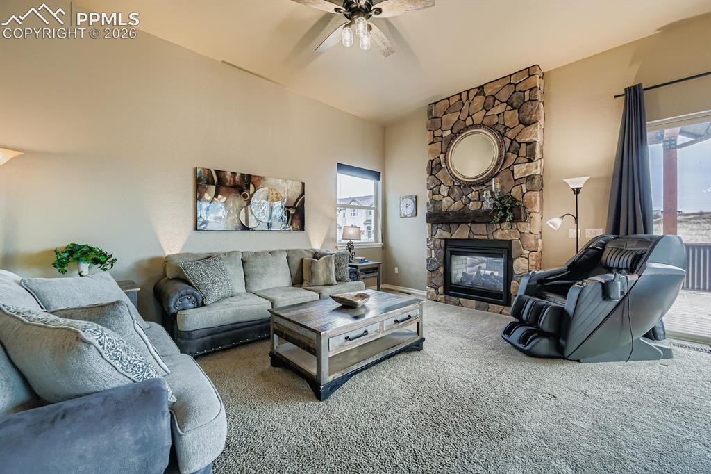10625 Slumber Ridge Way Colorado Springs, CO 80908 - Photo 5 of 36 Stone double faced fireplace