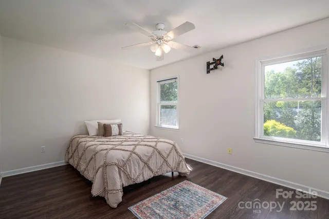 a bed room with a bed and a window