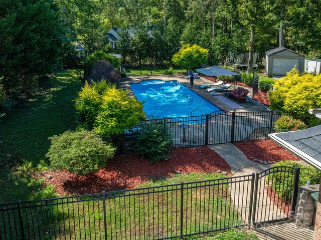 a view of a backyard with sitting area