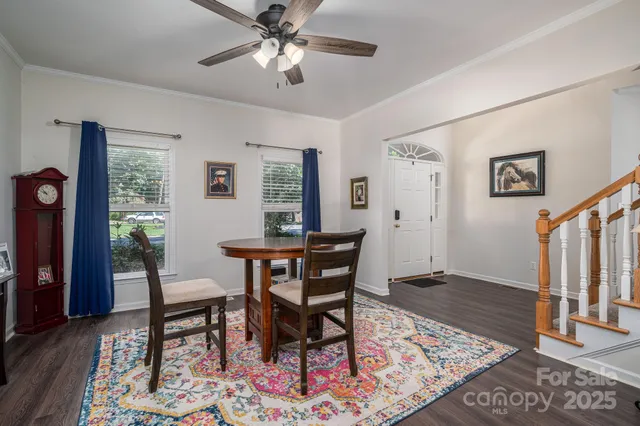 a view of a livingroom with furniture window and wooden floor