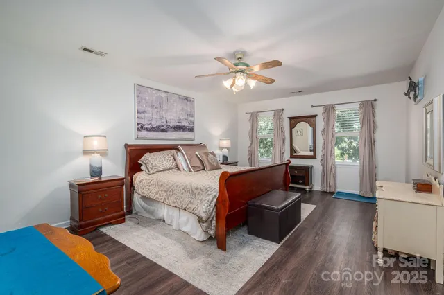 a bed room with a bed and a chandelier