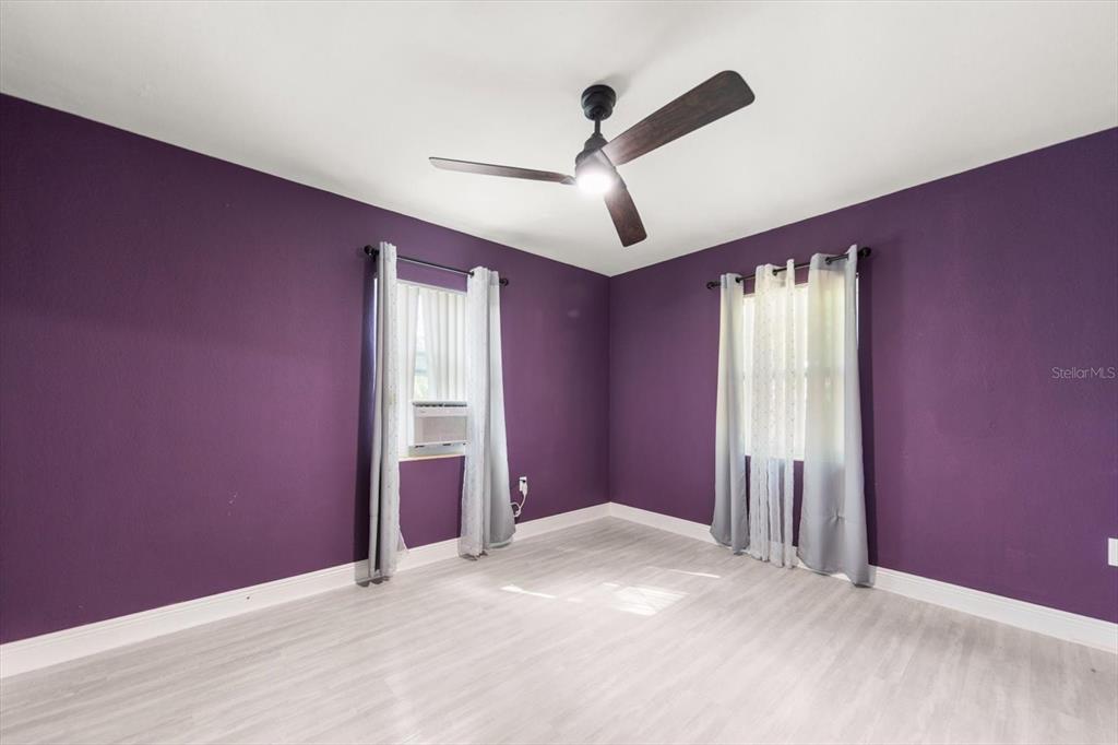 611 11th Street Northwest Largo, FL 33770 - Photo 20 of 37 an empty room with windows and fan