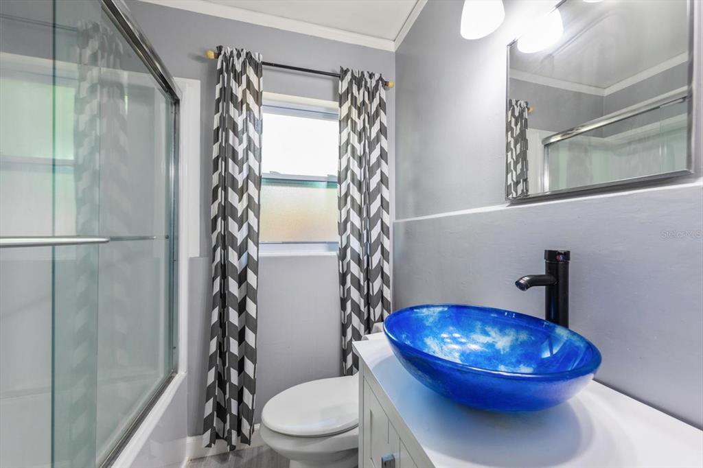 611 11th Street Northwest Largo, FL 33770 - Photo 23 of 37 a bathroom with a toilet and a shower