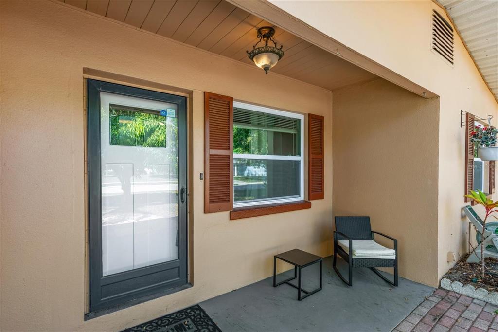 611 11th Street Northwest Largo, FL 33770 - Photo 3 of 37 a balcony with table and chairs