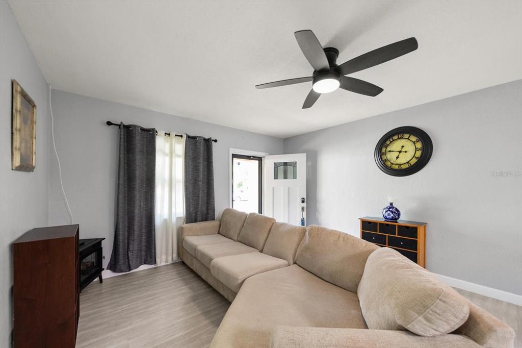 611 11th Street Northwest Largo, FL 33770 - Photo 5 of 37 a living room with a couch and a window