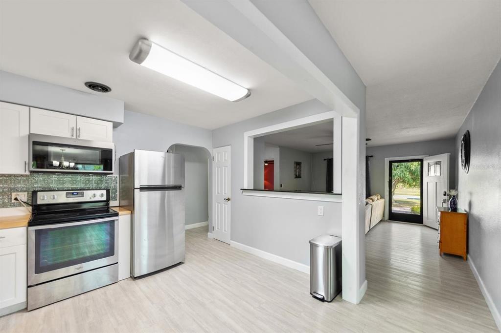 611 11th Street Northwest Largo, FL 33770 - Photo 10 of 37 a view of kitchen with furniture and refrigerator