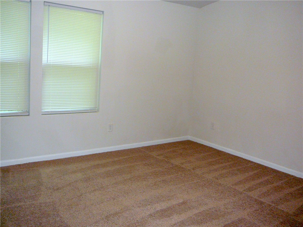 147 Evonshire Boulevard Anderson, SC 29621 - Photo 10 of 19 Well-lit room with fresh carpeting and windows awaiting your personal touch.