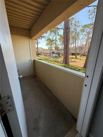 a room with wooden floor stairs and a table