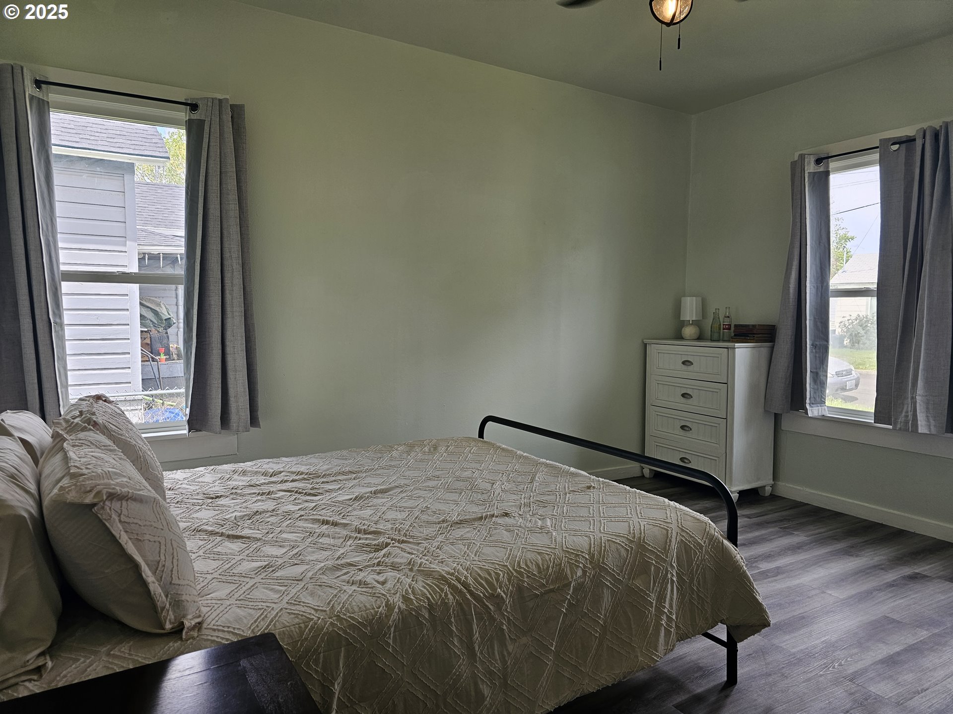 617 Southwest 3rd Street Pendleton, OR 97801 - Photo 8 of 42 a bedroom with a bed dresser and a window