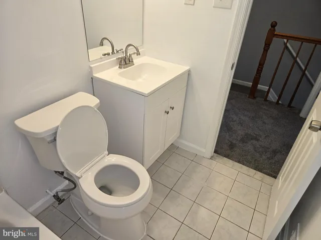 a bathroom with a toilet and a sink