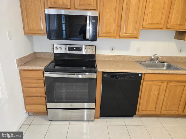 a kitchen with a stove and a microwave