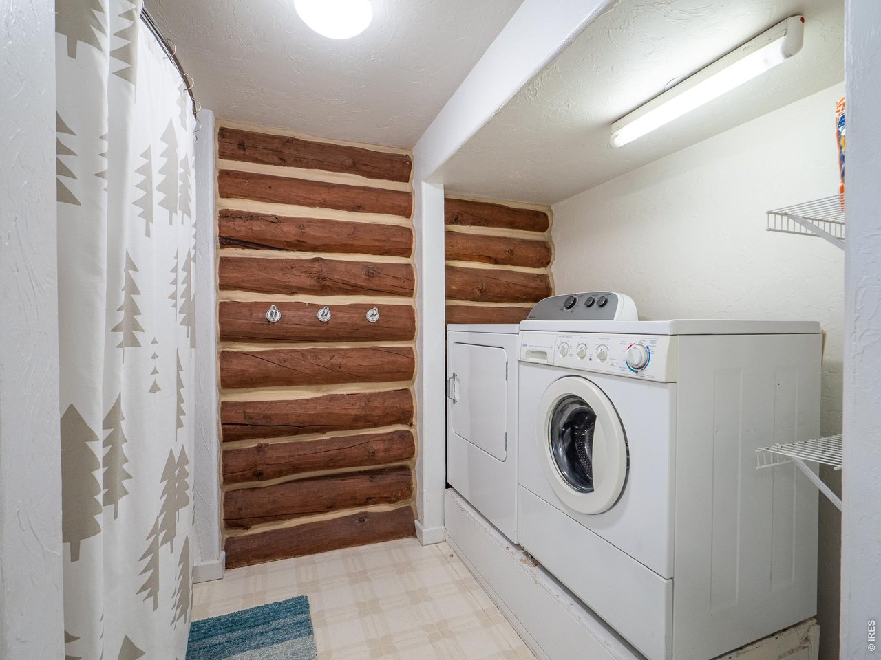 296 Caddo Road Red Feather Lakes, CO 80545 - Photo 16 of 50 Laundry area is conveniently located in main floor bathroom.