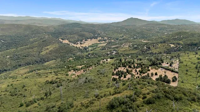 a view of a town with mountains in the background