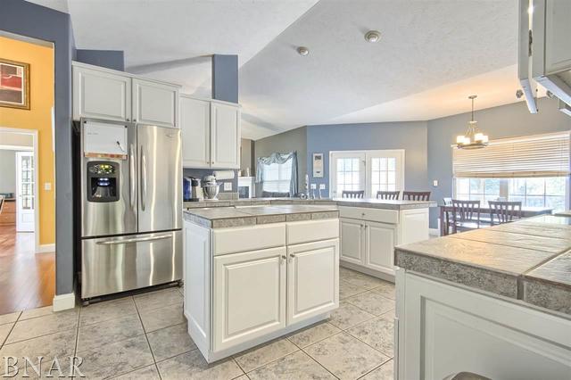 6762 Alexander Road Heyworth, IL 61745 - Photo 11 of 27 a kitchen with white cabinets and refrigerator