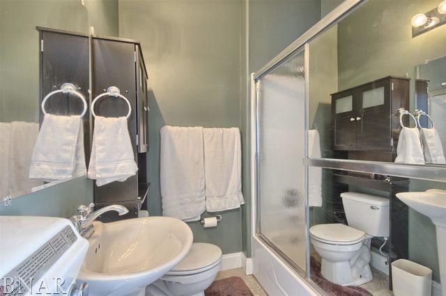 6762 Alexander Road Heyworth, IL 61745 - Photo 22 of 27 a bathroom with a sink toilet and shower
