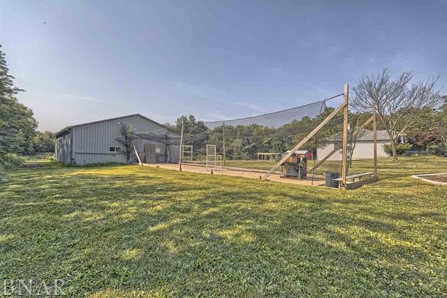 6762 Alexander Road Heyworth, IL 61745 - Photo 4 of 27 a swimming pool with outdoor seating and yard