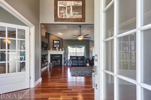 6762 Alexander Road Heyworth, IL 61745 - Photo 7 of 27 a view of a living room with a large window and wooden floor