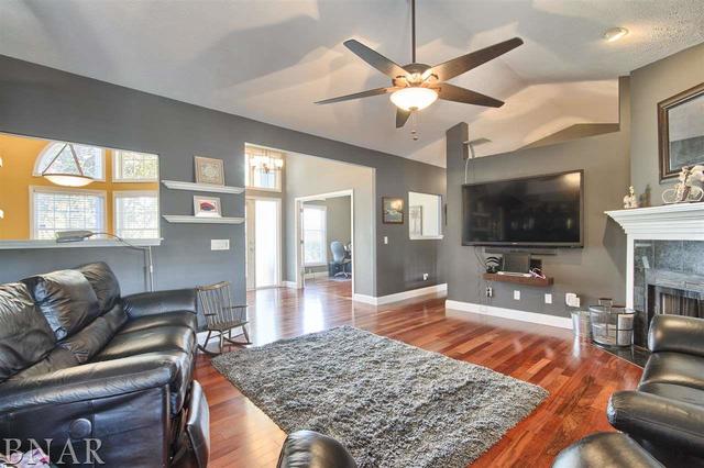 6762 Alexander Road Heyworth, IL 61745 - Photo 9 of 27 a living room with fireplace furniture and a flat screen tv