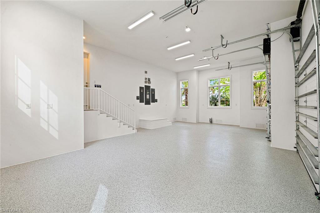 12 Sabre Lane Naples, FL 34102 - Photo 17 of 50 an empty room with windows and entrance