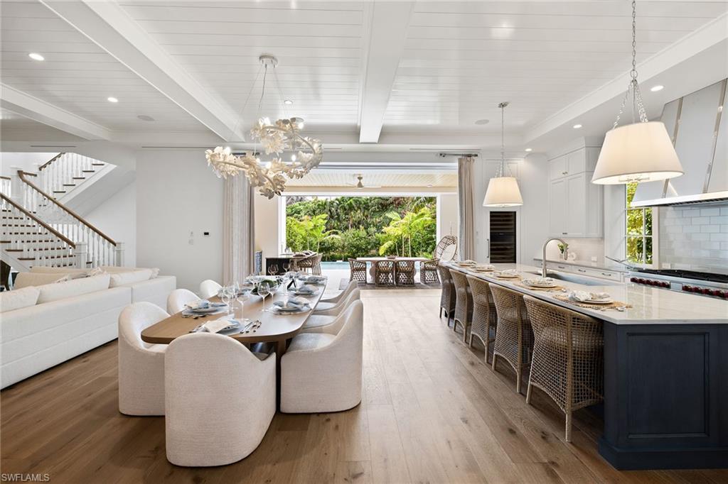 12 Sabre Lane Naples, FL 34102 - Photo 21 of 50 a large kitchen with a table and chairs