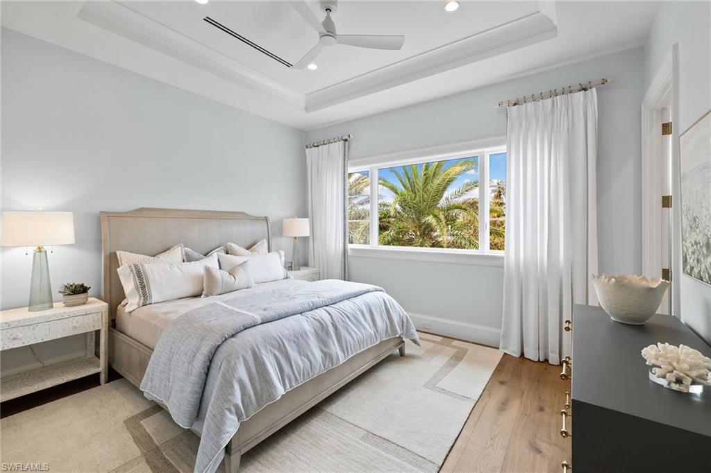 12 Sabre Lane Naples, FL 34102 - Photo 33 of 50 a bedroom with a bed and a window