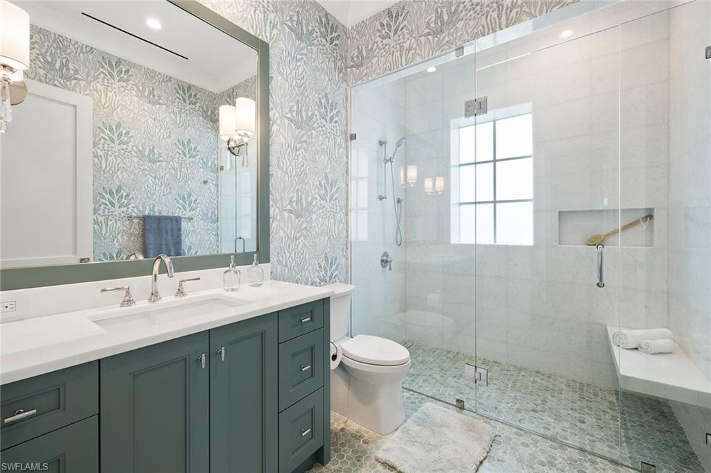 12 Sabre Lane Naples, FL 34102 - Photo 42 of 50 a bathroom with a sink a toilet and shower