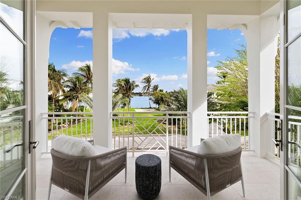 12 Sabre Lane Naples, FL 34102 - Photo 9 of 50 a balcony with furniture and garden