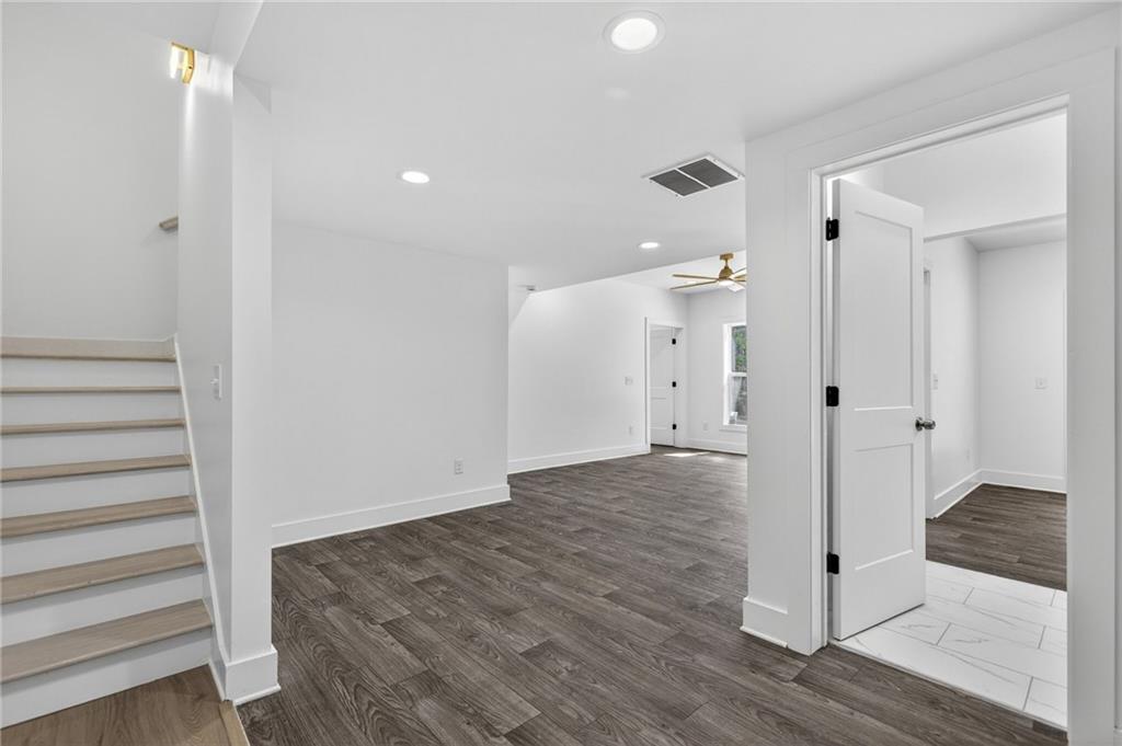 88 Carolyn Path Rockmart, GA 30153 - Photo 45 of 73 a view of a hallway with wooden floor and staircase