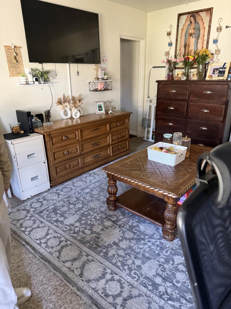 234 High Street Santa Cruz, CA 95060 - Photo 7 of 10 a living room with couches and flat screen tv