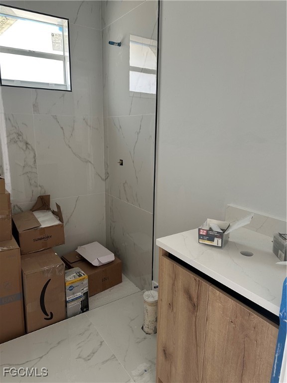 1073 Sherwin Street Port Charlotte, FL 33953 - Photo 11 of 14 a bathroom with a sink toilet and a mirror