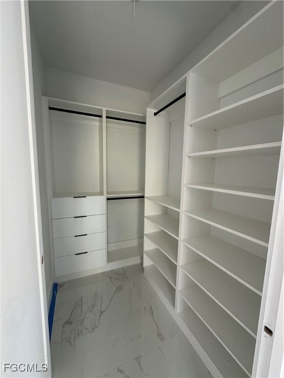 1073 Sherwin Street Port Charlotte, FL 33953 - Photo 12 of 14 a view of walk in closet with empty racks
