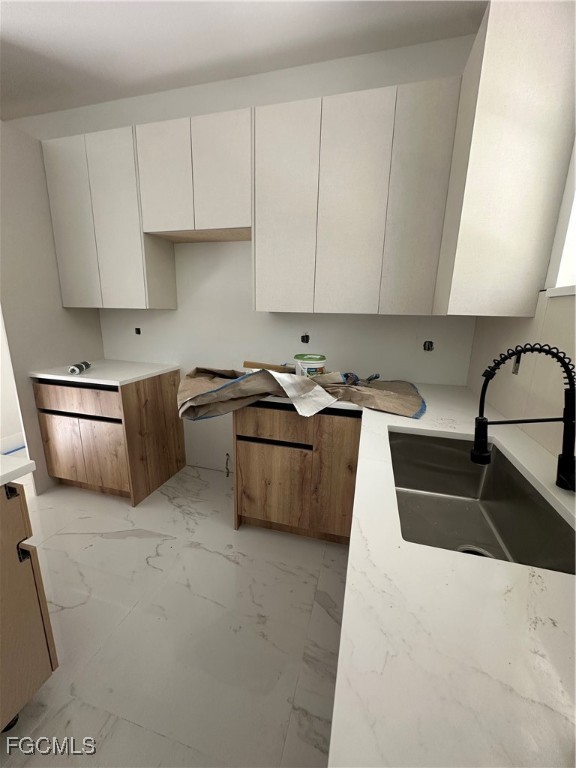 1073 Sherwin Street Port Charlotte, FL 33953 - Photo 4 of 14 a kitchen that has a sink and a stove