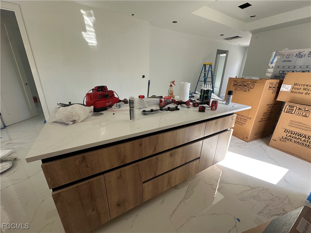 1073 Sherwin Street Port Charlotte, FL 33953 - Photo 5 of 14 a bathroom with a sink and a mirror