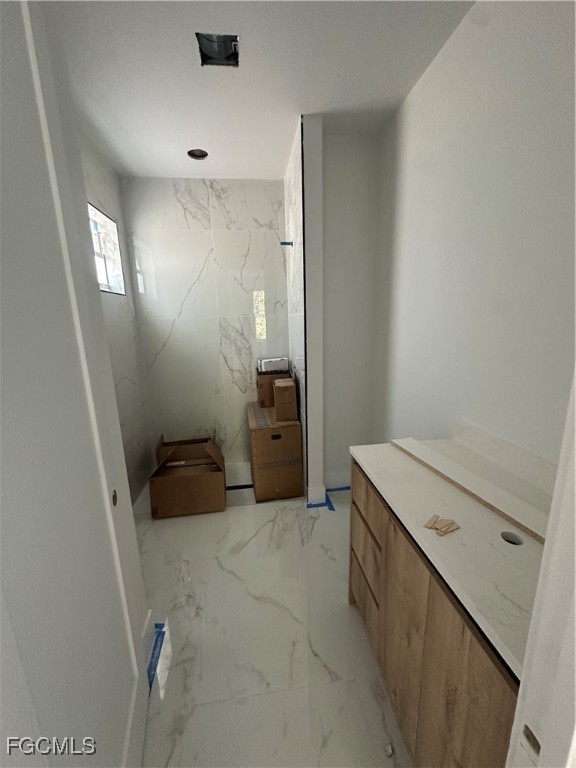 1073 Sherwin Street Port Charlotte, FL 33953 - Photo 10 of 14 a bathroom with a sink and mirror