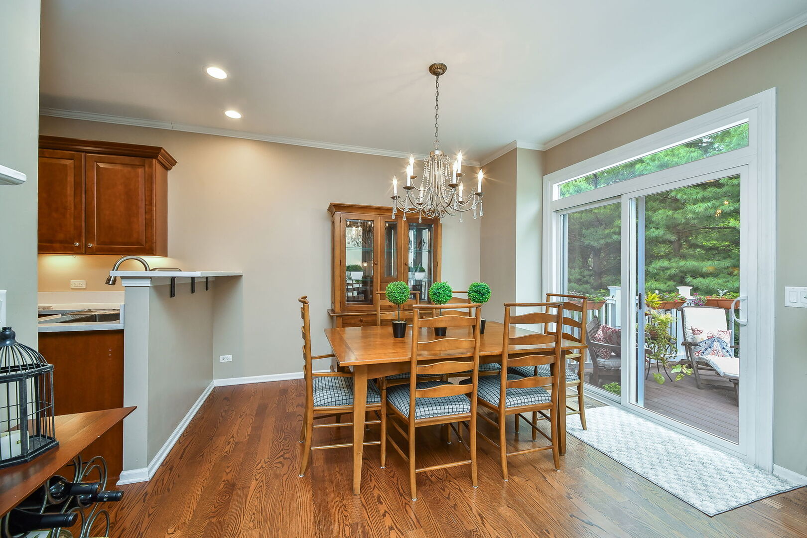 375 Ridge Road North Aurora, IL 60542 - Photo 5 of 24 a dining room with furniture a chandelier and wooden floor