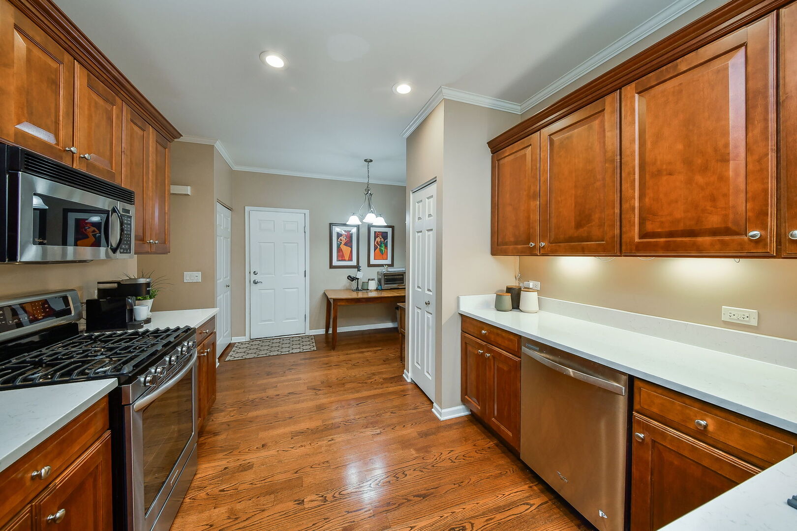 375 Ridge Road North Aurora, IL 60542 - Photo 6 of 24 a kitchen with stainless steel appliances granite countertop a stove a sink dishwasher and a microwave oven with large cabinets