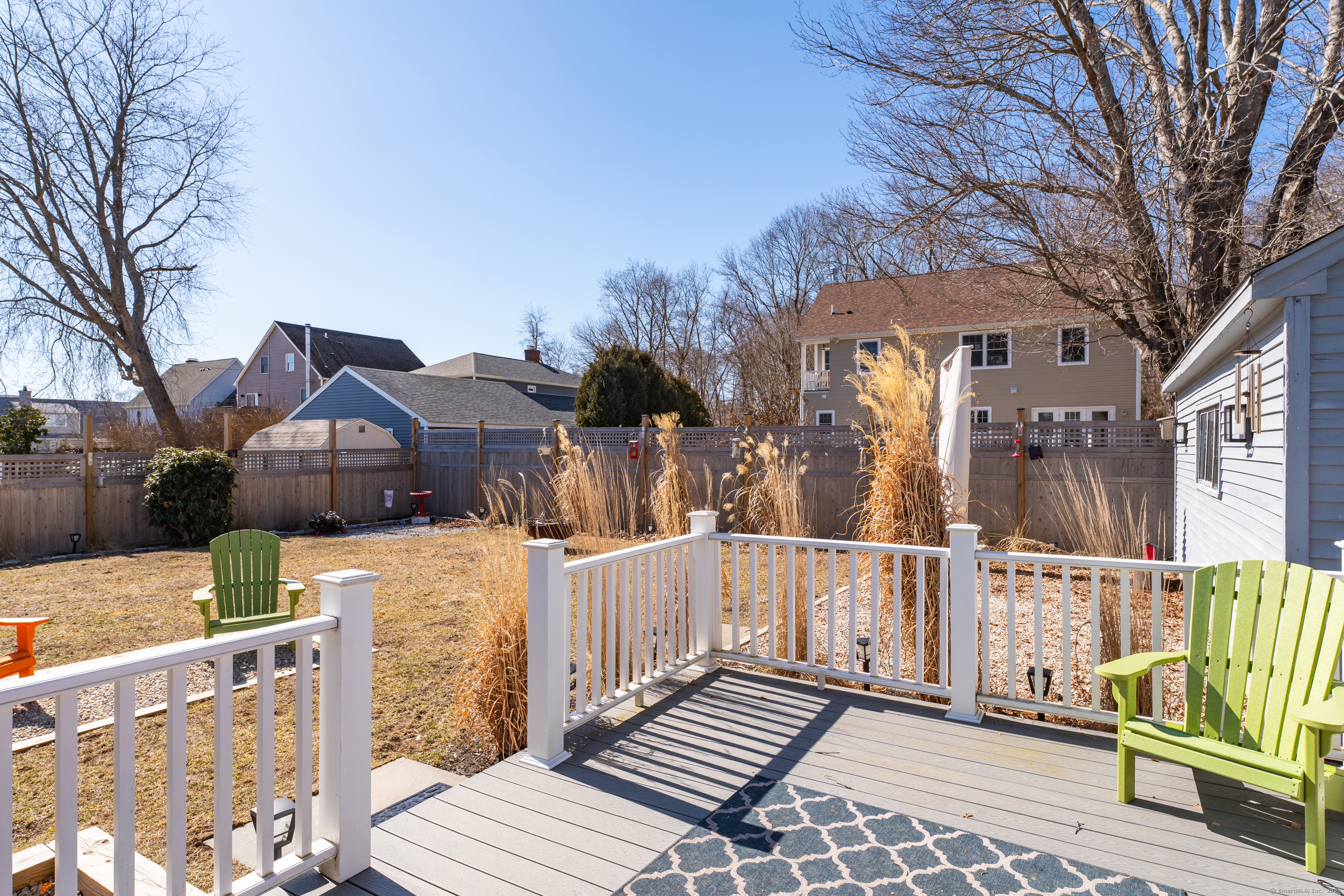 32 Bassett Lane Madison, CT 06443 - Photo 34 of 39 a view of a house with wooden fence