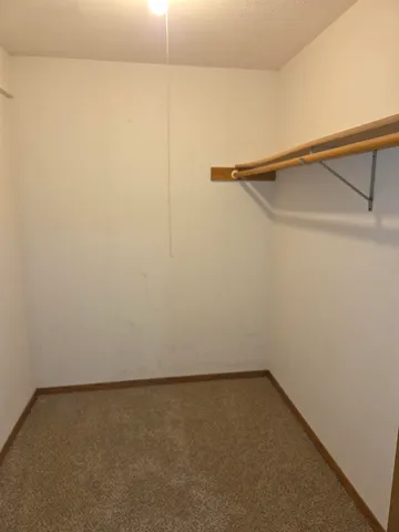 a view of backyard with swimming pool and outdoor seating