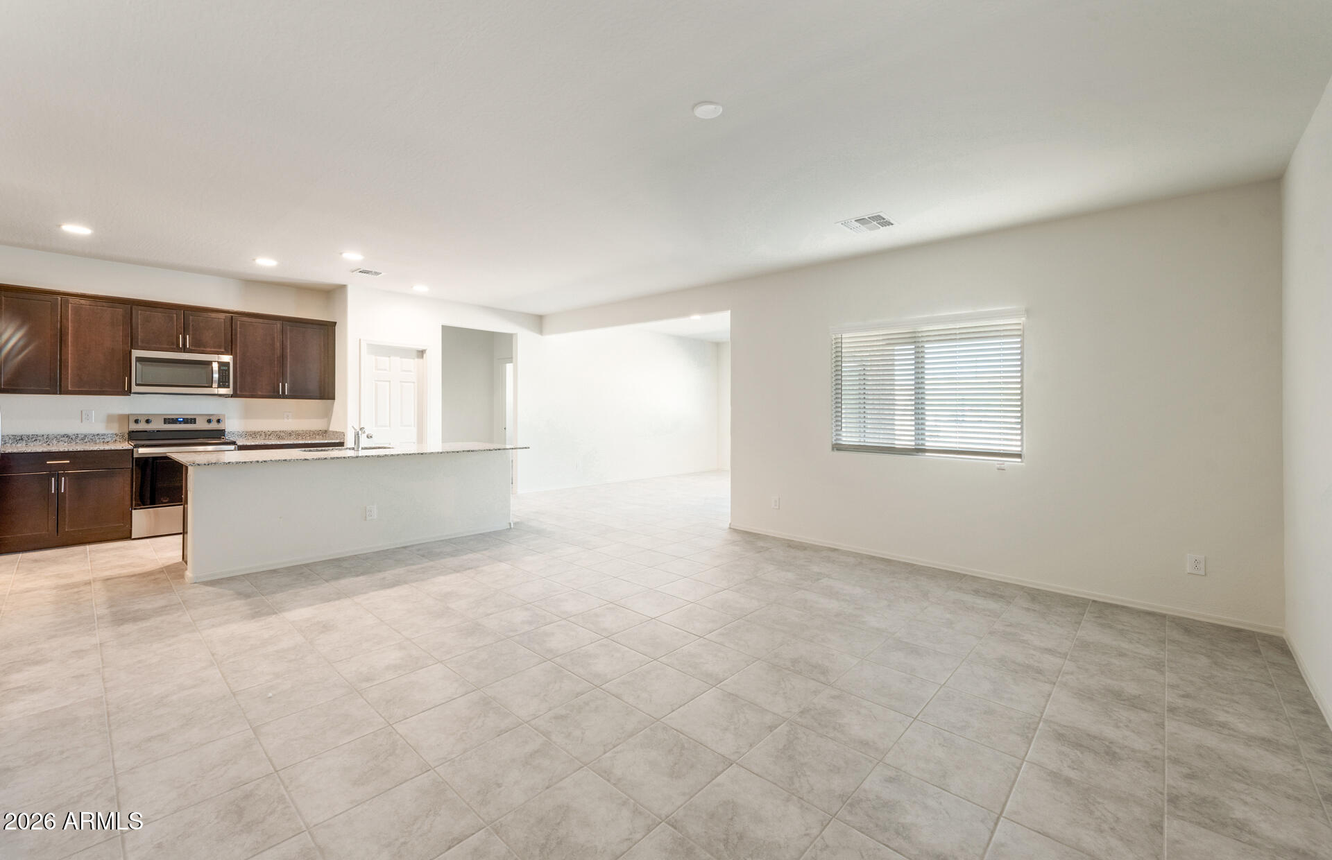 42990 West Palo Amarillo Road Maricopa, AZ 85138 - Photo 8 of 23 7 - Gathering Room and Kitchen